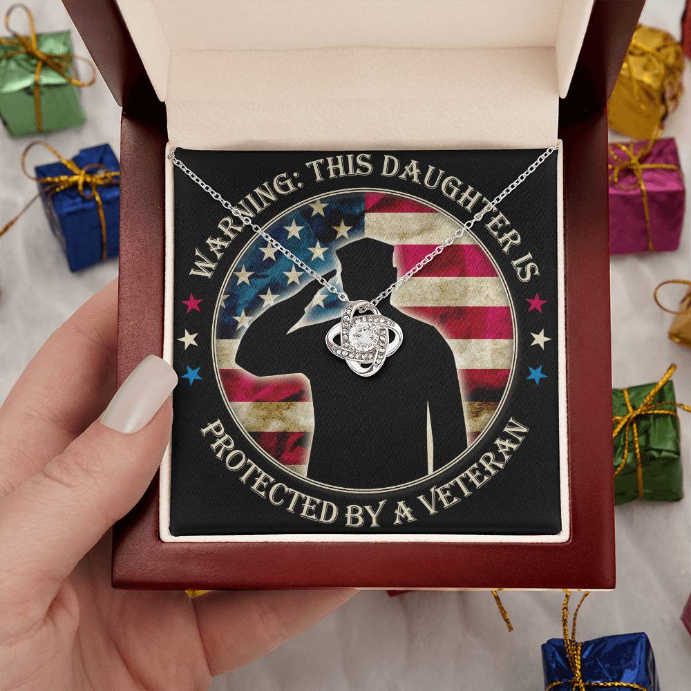 Warning: This Daughter Is Protected by a Veteran Mom ~ Love Knot Neckla ~ necklace shown with its message card in a gift box